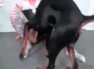 Black canine gets seduced by a horny woman